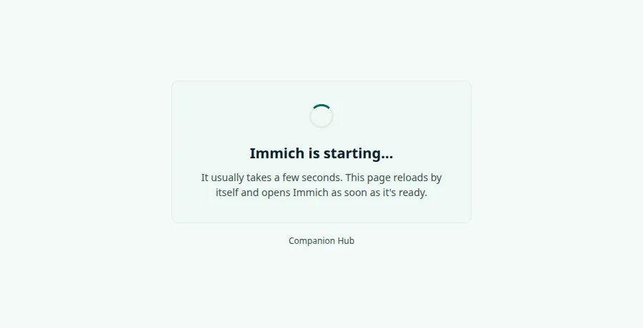 A centered card with a spinner, the heading Immich is starting… and the text It usually takes a few seconds. This page reloads by itself and opens Immich as soon as it's ready, above the words Companion Hub