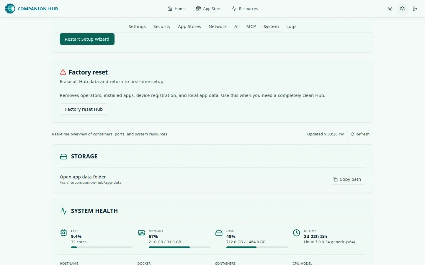 Settings, System tab, scrolled to the maintenance controls: a Restart Setup Wizard button, a Factory reset card with a Factory reset Hub button, and, below them, the inspector's header line reading Real-time overview of containers, ports, and system resources with an Updated time and a Refresh button, followed by the Storage and System health cards